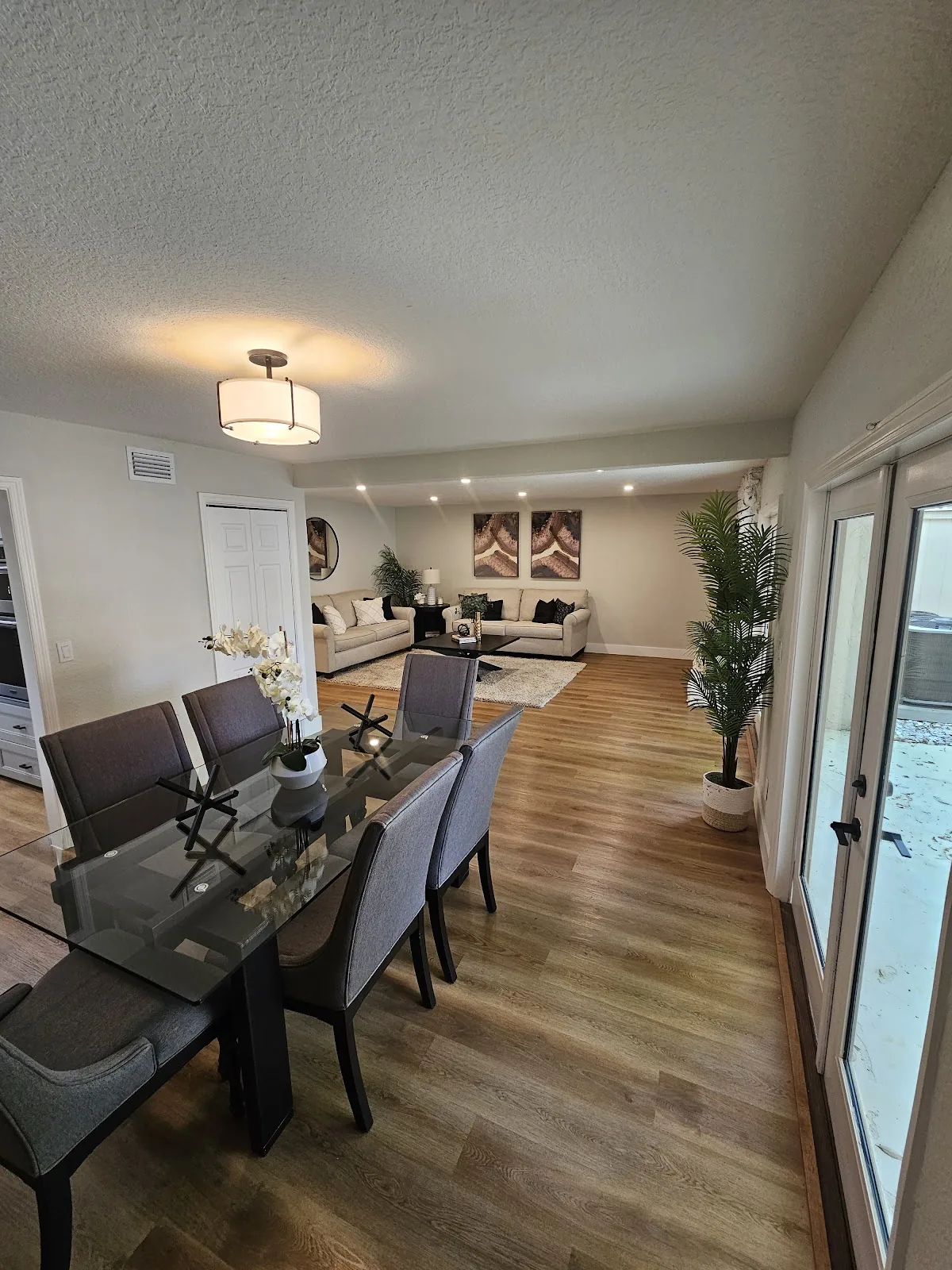 Waterproof luxury vinyl plank flooring installed in an Orlando living and dining room by Ultra Floors